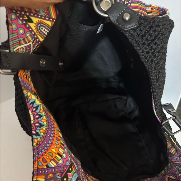 Sakroots bag, characterized by its distinctive bohemian and colorful design. - Picture 8 of 12